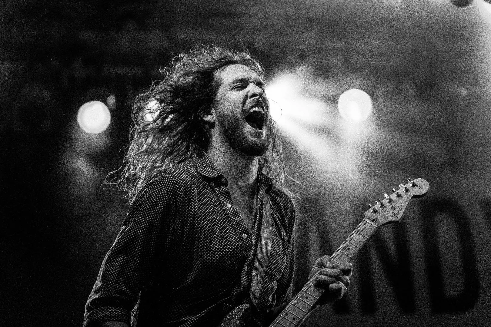 Guitarist performing with intensity